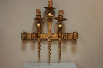 A pair of 1930s gilt iron wall lights