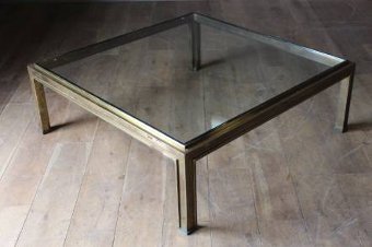 A chic patinated square brass coffee table