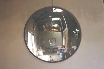 A huge early C20th convex mirror