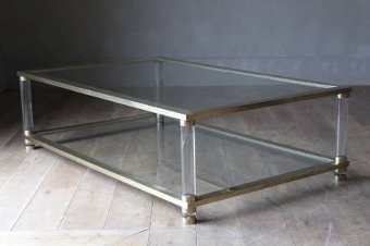 A large 2 tier French brass and lucite coffee table