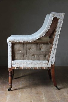 A late GIII upholstered library chair in original ticking