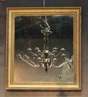 A near pair of C19th ripple gilt mirrors