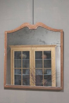 An early C20th limed oak mirror