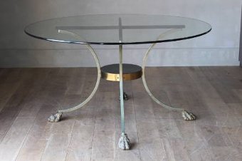 A paw footed brass and glass centre table