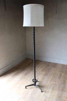 A 1930s50s metal lamp stand in the style of Gilbert Poillerat