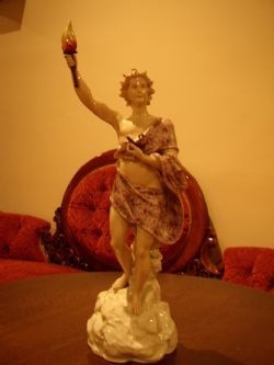 A FINE CONTINENTAL FIGURE OF A ROMAN OR GRECIAN OLYMPIAN HOLDING A TORCH C1850-60 