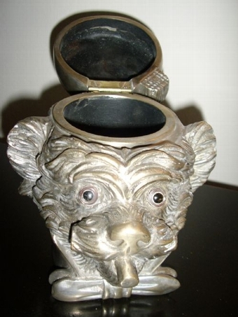 Antique MONKEY HEAD TOBACCO JAR WITH  HINGED LID IN THE FORM OF A  FEZ CAP & BEING  HAND CRAFTED FROM HIGHLY POLISHED FAUX SILVER METAL ALLOYS &  MEASURING 6.5 INCHES HIGH 