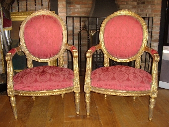 PAIR OF GILT DECORATIVELY CARVED WOODEN SALON ARMCHAIRS IN EARLY FLORREL WINE EARLY UPHOLSTERY & ...