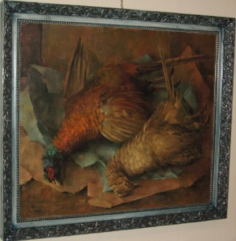 OIL PAINTING OF A BRACE OF DEAD PHEASANTS LAID OUT ON BROWN PAPER 34.5 X 30.5 INCHES
