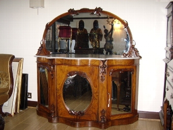 EARLY VICTORIAN SERPENTINE SHAPED CREDENZA IN FIGURED WALNUT WITH MIRROR BACK AND DECORATED WITH ...
