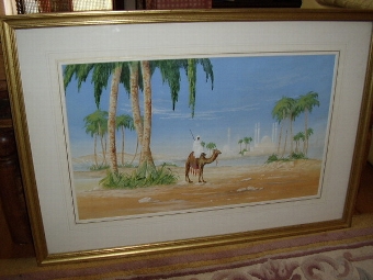 WATERCOLOUR WITH OASIS & PALACE IN THE BACKGROUND DEPICTING CAMEL & RIDER C1923