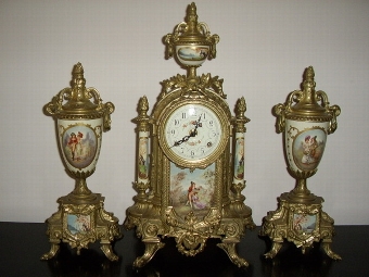 FRENCH CLOCK SET WITH PAINTED PORCELAIN PANELS & GARNITURES.