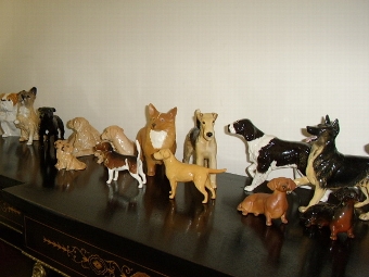 COLLECTION OF 18  ROYAL DOULTON & BESWICK ASSORTED PORCELAIN GLAZED DOGS 
