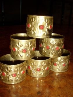SET OF 6 HAND MADE BRASS NAPKIN RINGS INSET WITH RED CORREL & MADE IN LONDON 