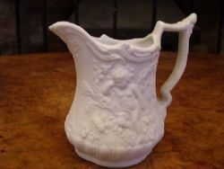 PARIAN MILK JUG DEPICTING CHERUBS C1900