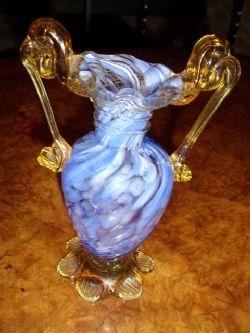 BLUE GLASS VASE WITH ORNATE AMBER HANDLES 