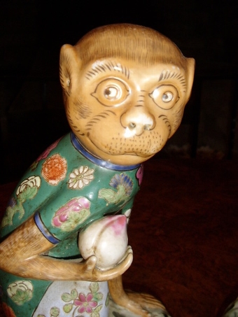 Antique PAIR OF PORCELAIN ENAMELLED MONKEYS SITTING HOLDING FRUIT 