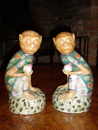 Antique PAIR OF PORCELAIN ENAMELLED MONKEYS SITTING HOLDING FRUIT 