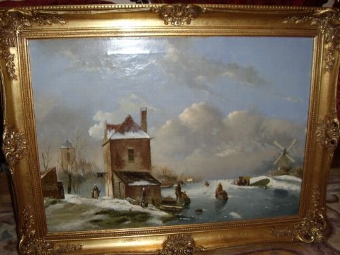 DUTCH WINTER LANDSCAPE OIL PAINTING OF CHILDREN SKATING ON ICE BY H.W.G.WINTER.  