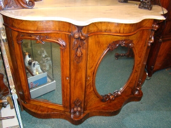 Antique EARLY VICTORIAN SERPENTINE SHAPED CREDENZA IN FIGURED WALNUT WITH MIRROR BACK AND DECORATED WITH CARVED ACORNS & LEAVES  C1837-50.