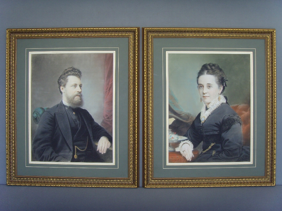 Antique A FINE PAIR OF VICTORIAN PORTRAITS OF MAN & WIFE EXECUTED BY AN OUTSTANDING ARTIST IN PASTEL & GOUACHE UNDER GLASS BEING PRESENTED IN DECORATIVE GILT FRAMES 30 X 25 INCHES