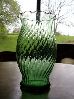 GREEN GLASS VASE WITH FINE RIBBING & ESCALOPED FLUTING TO RIM