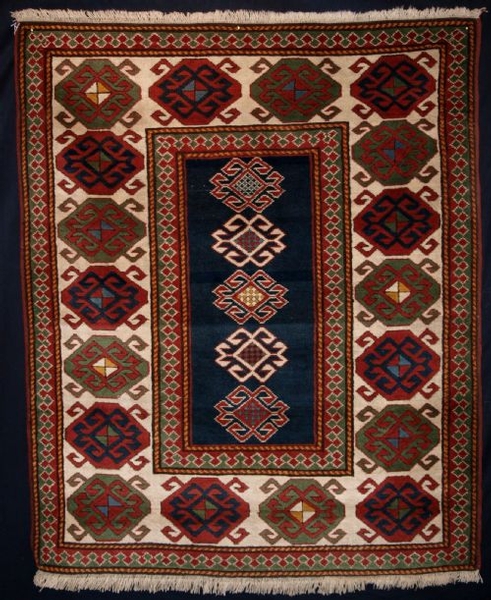 OLD TURKISH RUG OF CAUCASIAN DESIGN, ABOUT 30 YEARS OLD