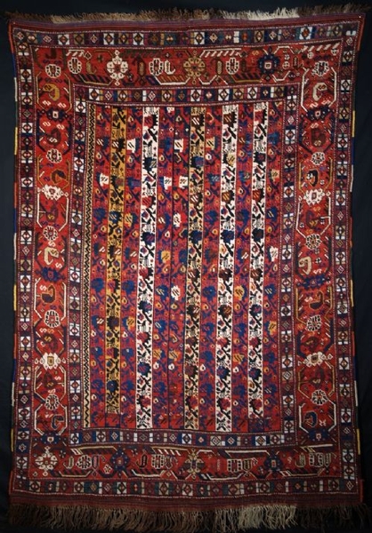 ANTIQUE RUG BY THE KHAMSEH TRIBE, OF RARE DESIGN, LATE 19TH CENTURY.