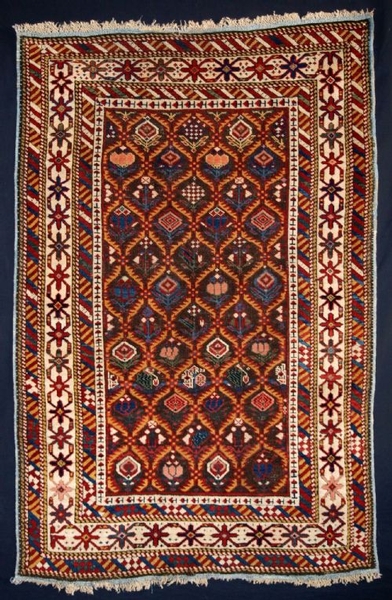 ANTIQUE DAGHESTAN RUG WITH FLORAL LATICE, LATE 19TH C.