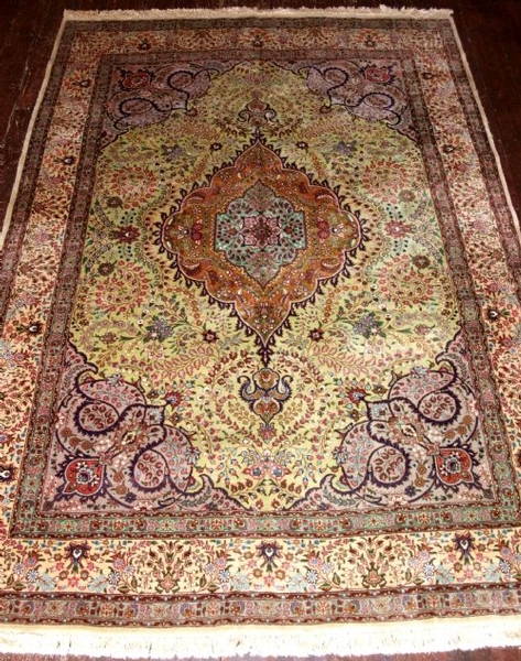 OLD PERSIAN TABRIZ CARPET WITH RARE GREEN FIELD, CIRCA 1950. 