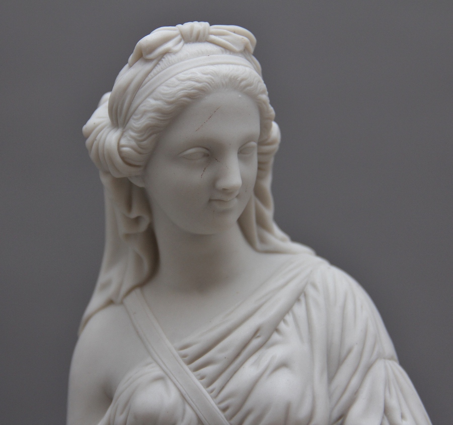 Antique 19th Century parian figure of a lady leaning on a column