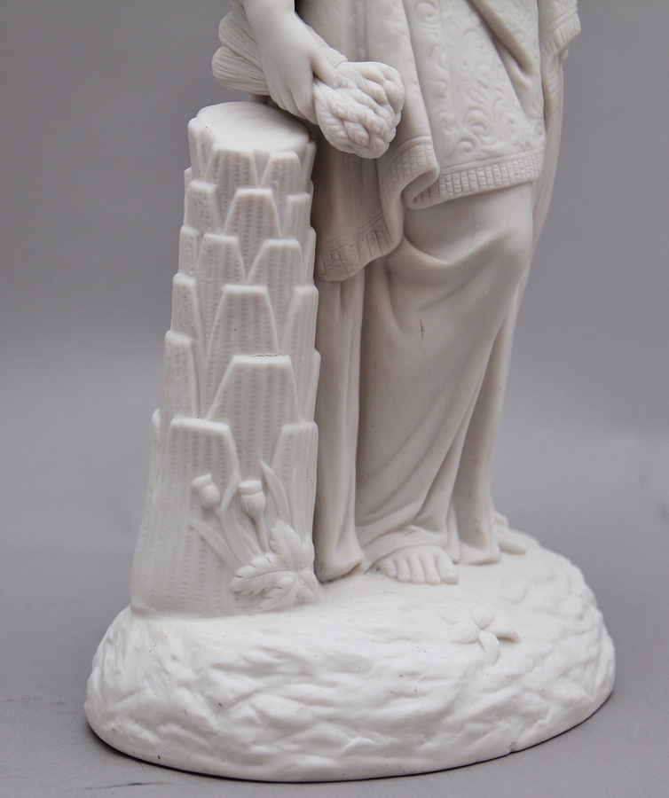 Antique 19th Century parian figure of a lady leaning on a column