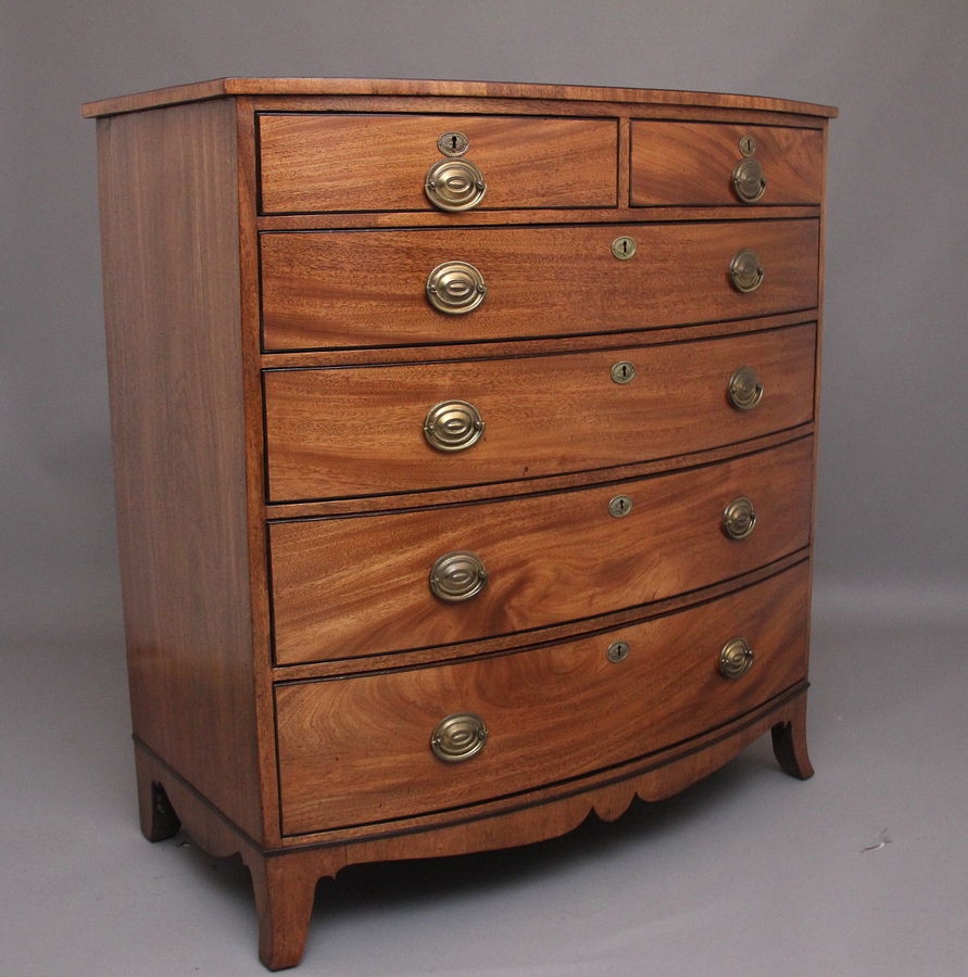 Antique A superb quality Early 19th Century tall mahogany bowfront chest of drawers