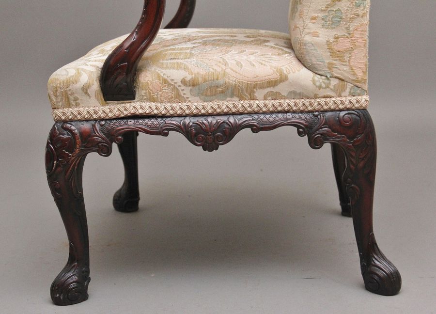 Antique 19th Century carved mahogany library armchair in the Chippendale style