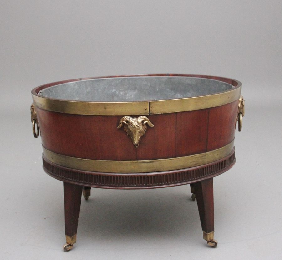 Antique A highly decorative early 19th Century mahogany and brass bound wine cooler