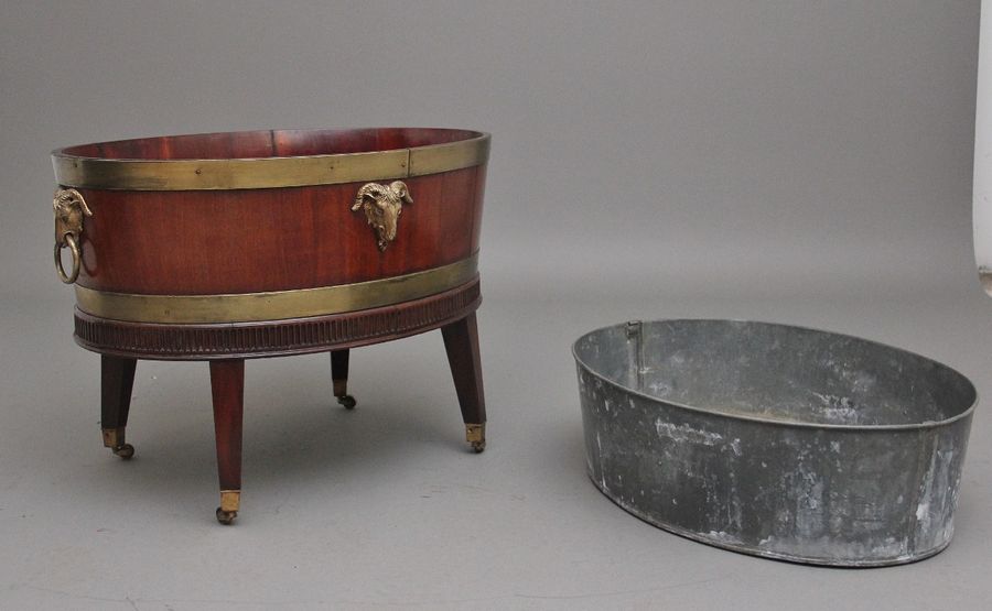 Antique A highly decorative early 19th Century mahogany and brass bound wine cooler