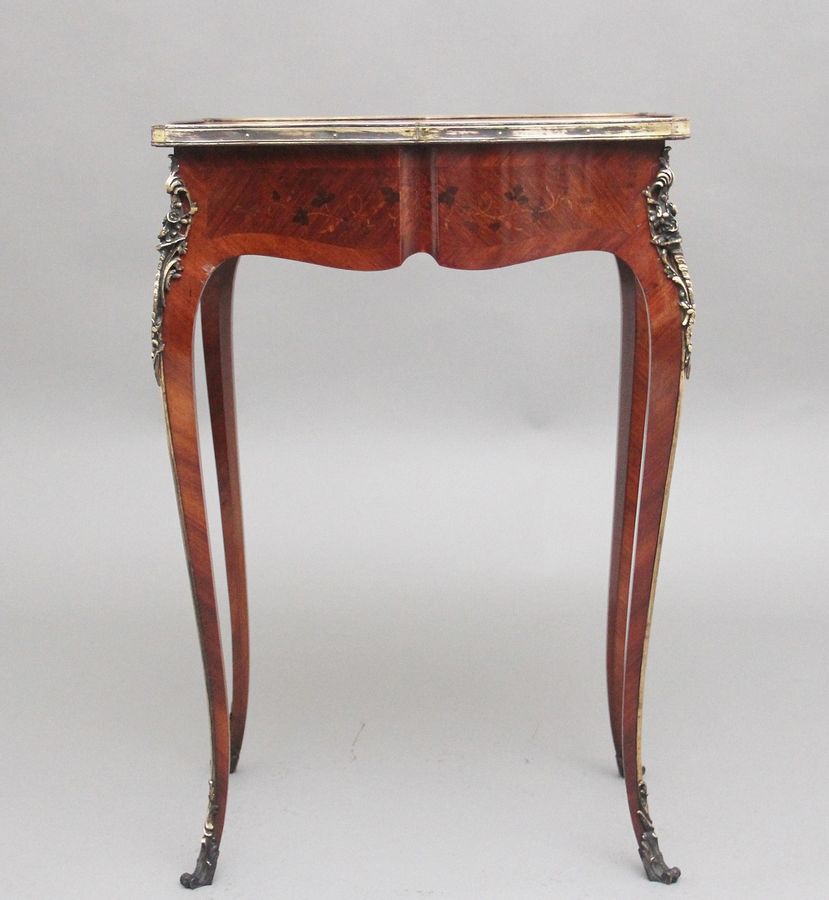 Antique A freestanding 19th Century French Kingwood and marquetry side table