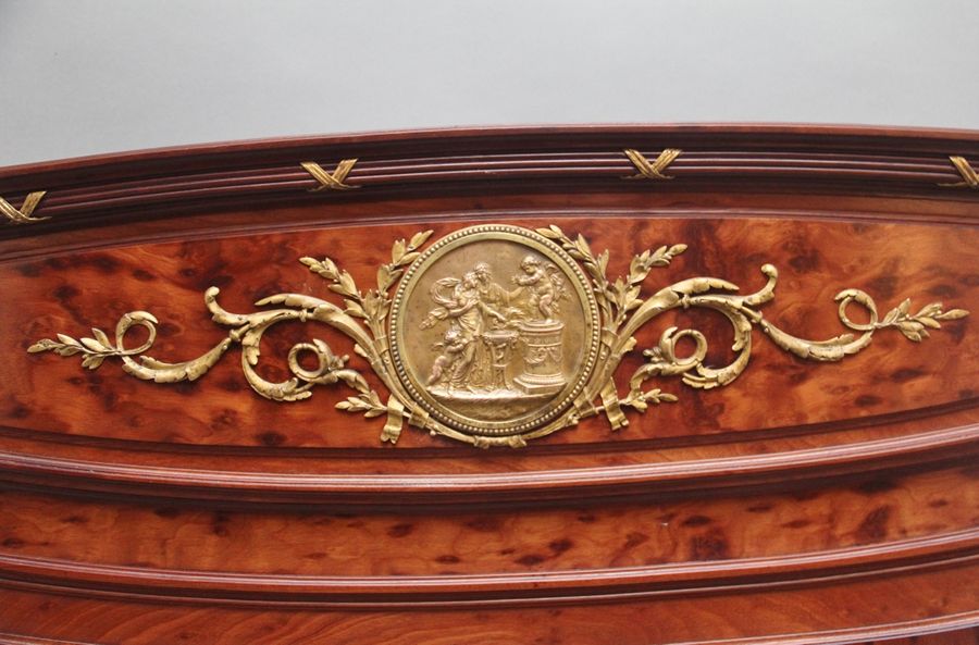 Antique A fabulous quality 19th Century French plum pudding mahogany and brass bed in the Neoclassical style