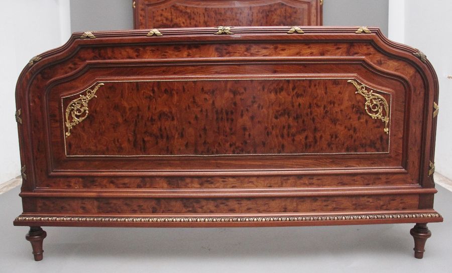 Antique A fabulous quality 19th Century French plum pudding mahogany and brass bed in the Neoclassical style