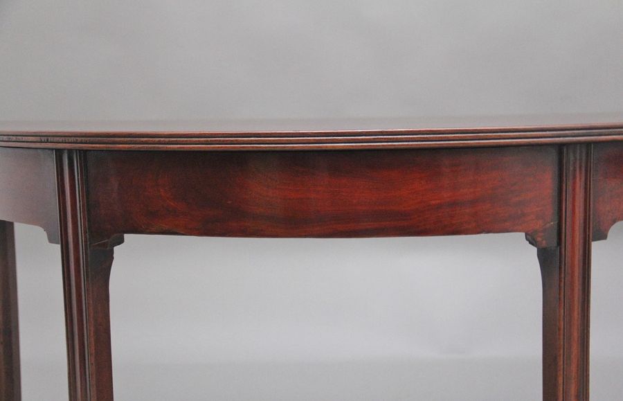 Antique A fine pair of early 19th Century mahogany demi-lune console tables