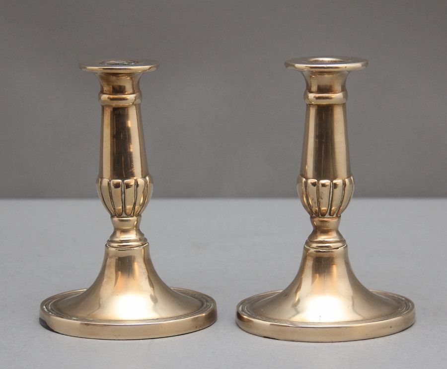 Antique A pair of brass Georgian candlesticks