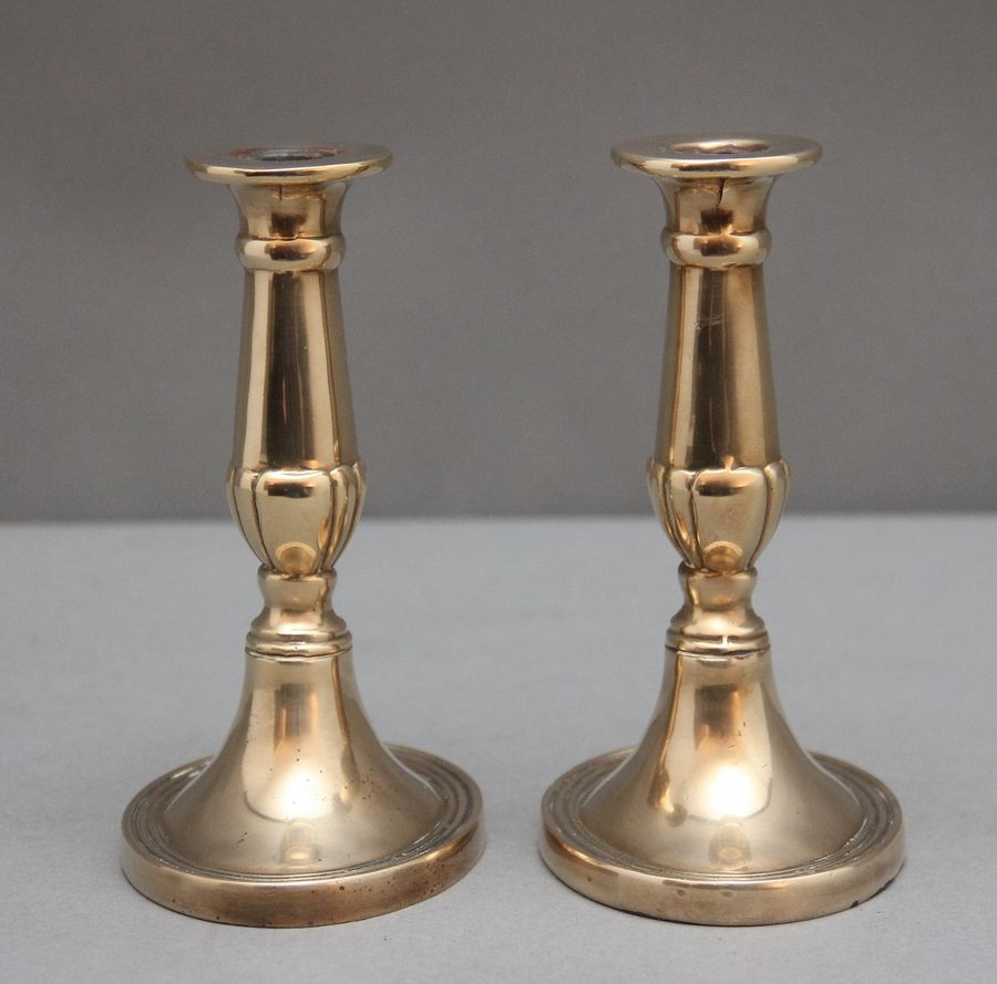 Antique A pair of brass Georgian candlesticks