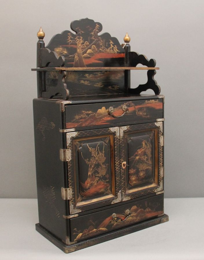 19th Century black lacquered and painted table cabinet