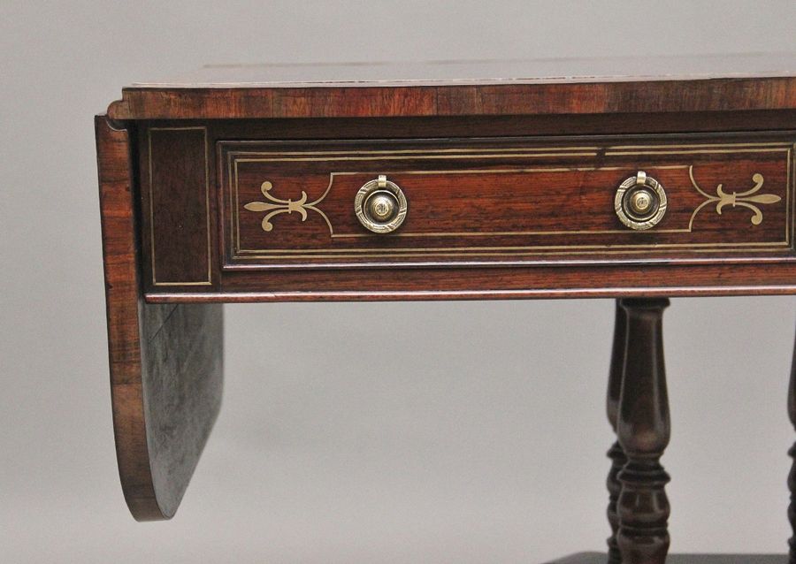 Antique Regency rosewood and brass inlaid sofa table