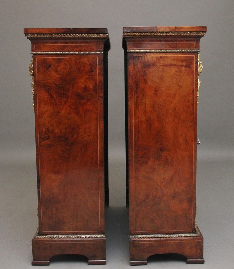 Antique Pair of 19th Century walnut pier cabinets by Edwards & Roberts