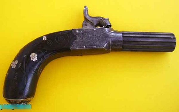 BOXLOCK POCKET PISTOL WITH GROTESQUE MASK ON BUTT, FLUTED BARREL 
