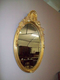 Early 20th.Century Oval Giltwood Mirror