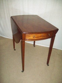 George 111. Mahogany Oval Pembroke Table.