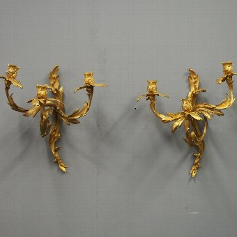 Pair of Louis XV Style Cast Brass and Gilded Sconces
