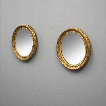  Pair of Victorian Oval Gilded Mirrors